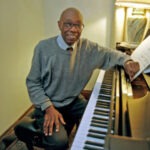 George Walker at the piano.